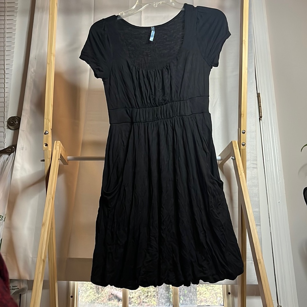 Black scoop neck dress with pockets.